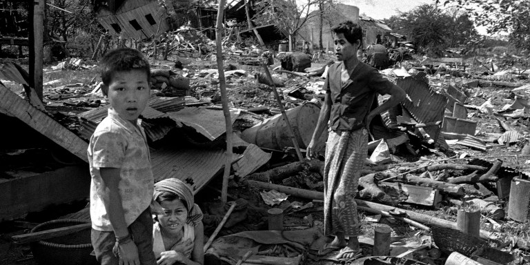 Members of a Cambodian family in the ruins of their home near Neak Luong  August 7, 1973. It was destroyed on August 6 in misdirected U.S. bombing raid. (AP Photo)