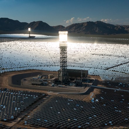 A boiler tower is surrounded by mirrors at the Ivanpah Solar Electric Generating System in the Mojave Desert on August 26, 2022 near Nipton, California.