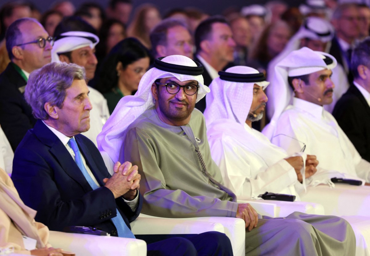United Arab Emirates' Minister of State and CEO of the Abu Dhabi National Oil Company (ADNOC), Sultan Ahmed al-Jaber (2-L) and US Presidential Envoy for Climate John Kerry, attend the opening session of the Atlantic Council Global Energy Forum, in the capital Abu Dhabi, on January 14, 2023. - Al-Jaber, the president of this year's COP28 climate talks, who heads one of the world's biggest oil companies, said less-polluting fossil fuels would remain part of the energy mix, along with renewables and other solutions. (Photo by Karim SAHIB / AFP) (Photo by KARIM SAHIB/AFP via Getty Images)