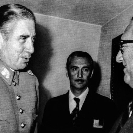 Chilean President Augusto Pinochet greets Secretary of State Harry Kissinger on his arrival at the President's office. Kissinger took up the issue of the Human Rights Commission which has raised objections to Chilean abuses of civil liberties, but stopped short of taking any direct American action against Chile in the Organization of American States meeting here.